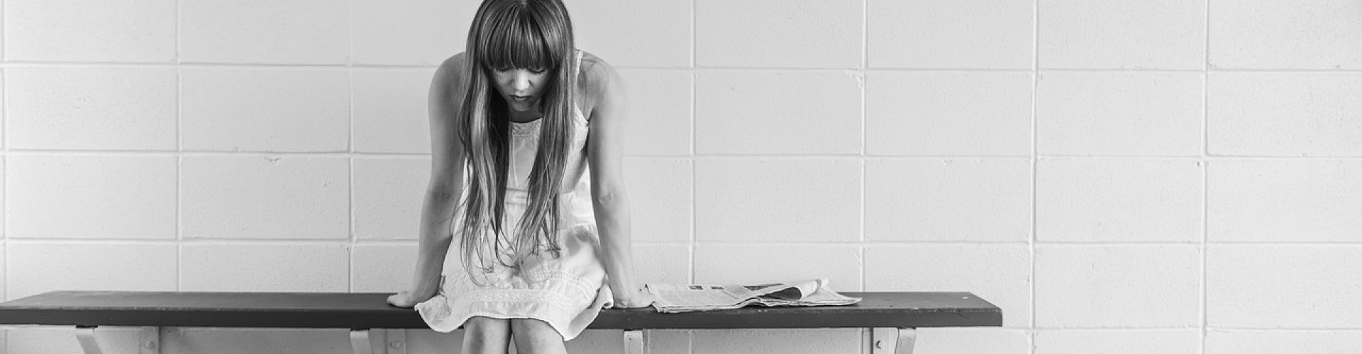 worried girl, woman, waiting, sitting, thinking, worry, black and white, sad, expression, people, person, depression, sadness, emotion, unhappy, adult, depressed, grief, frustration, despair, human, sad girl, problem, stressed, young, female, girl, long hair, dress, bench, concrete, wall